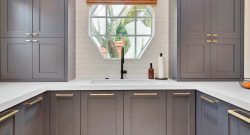 gray kitchen cabinets with gold hardware